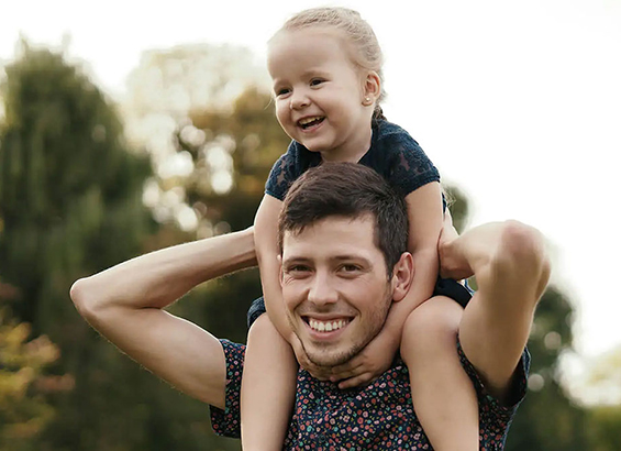 A father carrying his child